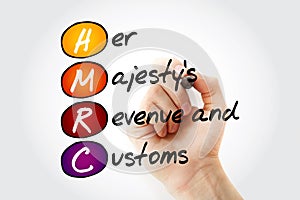 HMRC - Her Majesty`s Revenue and Customs acronym with marker, business concept background photo