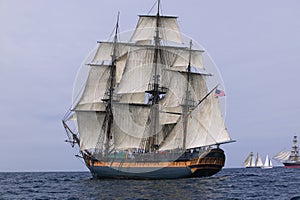 HMS Surprise sailing at sea under full sail