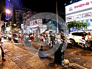 Ho Chi Minh City street filled with mopeds and motorcycles