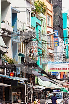 Ho Chi Minh City street in Vietnam with tangle of electrical wires