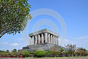 Ho Chi Minh Mausoleum in Hanoi Vietnam with big tree on the left