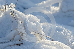 Hoarfrost background texture. Fresh ice and snow winter backdrop with snowflakes and mounds. Seasonal wallpaper.