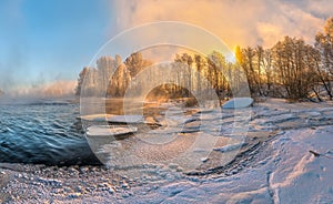 Hoarfrost on the river. Winter frosty dawn.