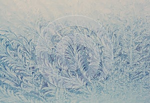Hoarfrost on the window in cold winter.