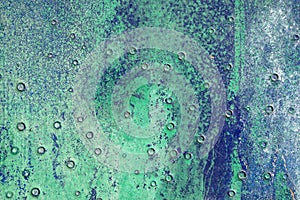 Hoarse,scratched and peeled surface with green and blue paint