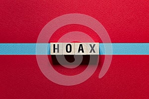 Hoax word concept on cubes