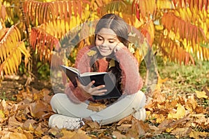 Hobby and interests. Child enjoy reading. Schoolgirl study. Study every day. Girl read book autumn day. Little child