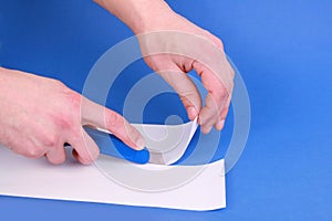 Hobby knife cutting paper photo