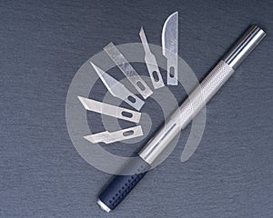 Hobby Knife Set for cutting wood, paper, plastic and cloth on gray stone