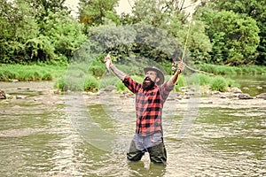 hobby for reel men. fisherman show fishing technique use rod. mature man fly fishing. man catching fish. bearded fisher