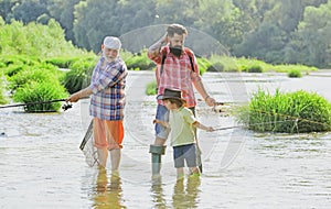 Hobby and sport activity. Men hobby. Summer weekend. Father teaching son how to fly-fish in river. Summer day. Anglers.