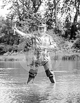 Hobby sport activity. Pensioner leisure. Fish farming pisciculture raising fish commercially. Fisherman fishing photo