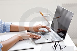 Hobby, work and study online. African american girl typing on laptop at workplace photo
