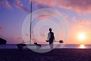 Hobie cat or catamaran on the beach at beautiful sunrise early morning