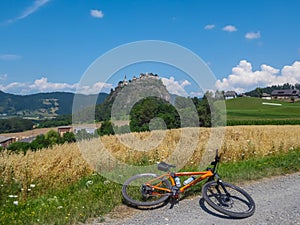 Hochosterwitz - Mountain bike on scenic road leading to medieval castle Burg Hochosterwitz build on hilltop in Sankt Georgen