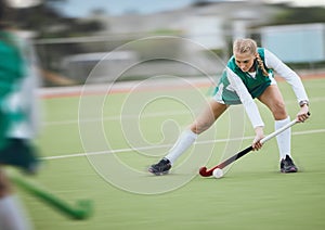 Hockey, athlete and woman running in game, tournament or competition with ball, stick and action on artificial grass