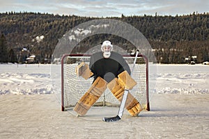 Hockey goalie outside on winter season with beautiful equipment