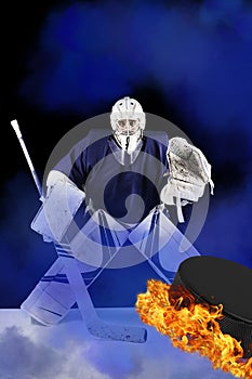 Hockey goalie stands in blue smoke ready to catch fiery puck