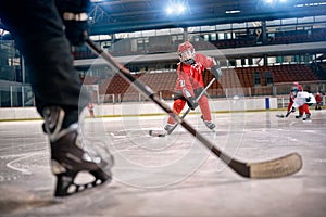 Hockey match at rink player in action