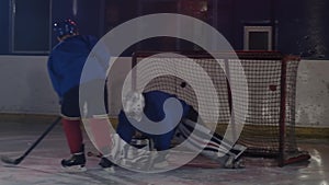 Hockey player carries out an attack on the opponent`s goal and scores a goal in extra time. The player brings victory to