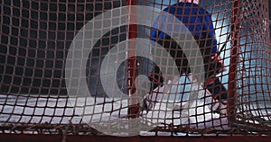 Hockey player carries out an attack on the opponent`s goal and scores a goal puck beating the goalkeeper. Visas for the