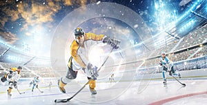 Hockey player in helmet and gloves at the winter stadium. Sport concept. Athlete in action. Winter