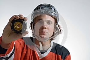 Hockey Player Holding a Puck - Horizontal