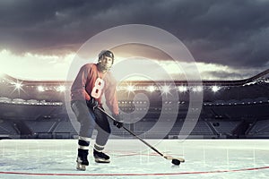 Hockey player on ice . Mixed media