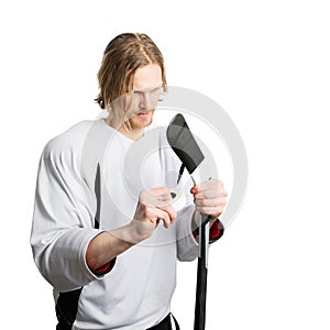 Hockey player taping stick