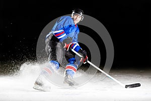 Hockey player turning around skating on ice