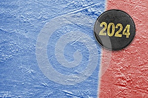 Hockey puck on blue and red ice