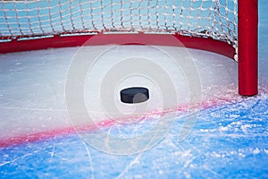 Hockey puck crossing goal line photo