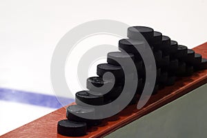 Hockey pucks on a white blur background. Texture, background, concept