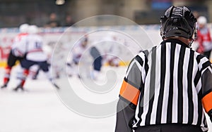 Hockey referee on ice photo