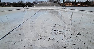 A hockey rink in a local park melts as spring arrives.