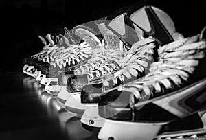 Hockey skates lined up in locker room