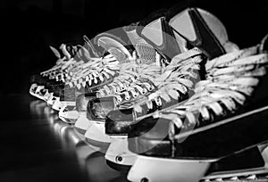 Hockey skates lined up in locker room