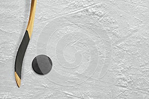 Hockey stick and puck on the ice