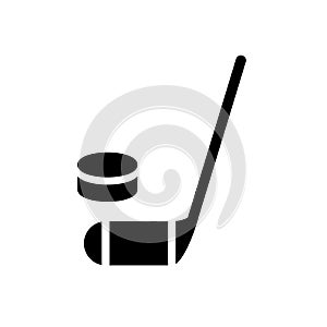Hockey stick and puck icon. Simple filled hockey stick and puck vector icon. On white background. photo