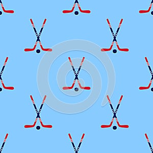 Hockey vector background. American ice hockey sticks and puck seamless pattern in a USA flag traditional colors and