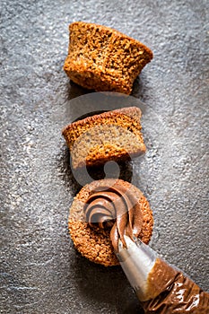 Hocolate cupcake with chocolate cream in white capsules with mint