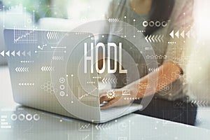 Hodl with woman using laptop