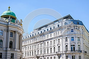 Hofburg imperial palace of Habsburg dynasty near building in Vienna, Austria. photo