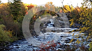 The Hog's Back Falls in Canada. Fall season in park with waterfalls and river