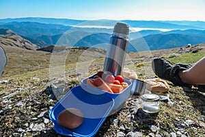 Hohe Veitsch - People eating sandwiches with vegetables and drinking tea on top of mount Hohe Veitsch in MŸrzsteg Alps, Styria