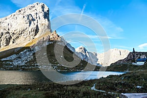 Hohe Warte - Reflection in a calm Alpine lake with a small cottage in the back