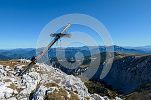 Hohe Weichsel - A wooden cross on top of Hohe Weichsel, Alpine peak in Austria. The cross is leaning, as if it was going to fall