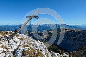 Hohe Weichsel - A wooden cross on top of Hohe Weichsel, Alpine peak in Austria. The cross is leaning, as if it was going to fall