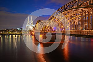 Hohenzollern Bridge with Cologne Cathedral at night in Cologne city, Germany