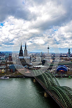 Hohenzollern bridge in Cologne and city skyline photo